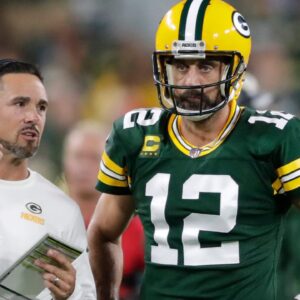 Green Bay Packers head coach Matt LaFleur talks with quarterback Aaron Rodgers (12) in between quarters against the Chicago Bears during their game on Sep 18, 2022, in Green Bay, Wisconsin.