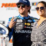 Team Penske's Ryan Blaney (12) poses with his fiancé Gianna Tulio on July 14, 2024