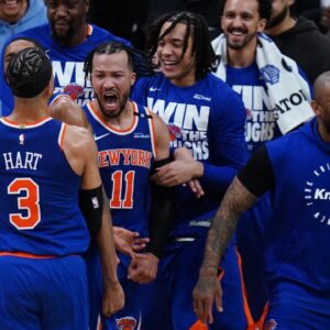New York Knicks guard Jalen Brunson (11) reacts with teammates after defeating the Boston Celtics in overtime during game one of the second round for the 2025 NBA Playoffs at TD Garden.