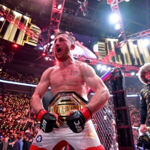 Merab Dvalishvili (red gloves) celebrates after winning a UFC bantamweight title fight against Umar Nurmagomedov (not pictured) during UFC 311 at Intuit Dome.