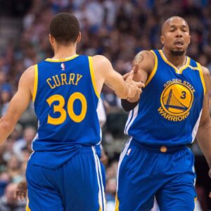 Golden State Warriors guard Stephen Curry (30) and forward David West (3) celebrates during the game against the Dallas Mavericks at the American Airlines Center. The Warriors defeat the Mavericks 112-87