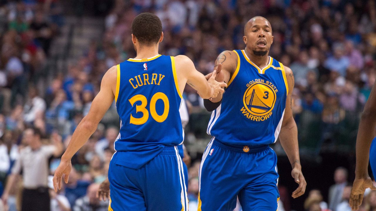 Golden State Warriors guard Stephen Curry (30) and forward David West (3) celebrates during the game against the Dallas Mavericks at the American Airlines Center. The Warriors defeat the Mavericks 112-87