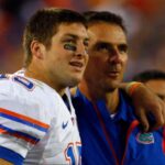 Florida Gators head coach Urban Meyer and quarterback Tim Tebow (15) hug each other against the Georgia Bulldogs against the Georgia Bulldogsduring the second half at Jacksonville Municipal Stadium. Gators won 49- 10.