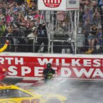 NASCAR Cup Series driver Joey Logano (22) reacts to his win to the fans during the All Star race at North Wilkesboro Speedway.