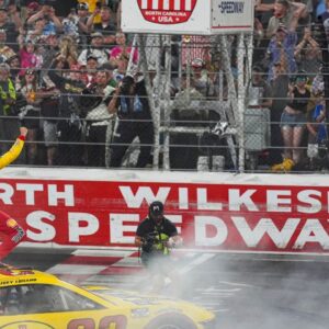 NASCAR Cup Series driver Joey Logano (22) reacts to his win to the fans during the All Star race at North Wilkesboro Speedway.