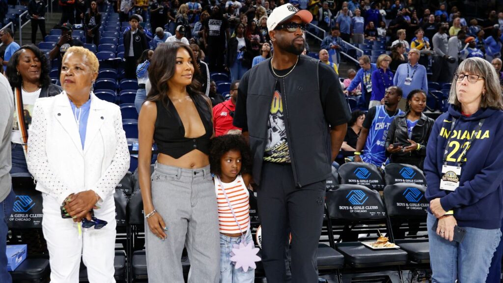 Former basketball player Dwyane Wade attends with his wife Gabrielle Union a WNBA game between the Chicago Sky and Connecticut Sun at Wintrust Arena.