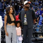 Former basketball player Dwyane Wade attends with his wife Gabrielle Union a WNBA game between the Chicago Sky and Connecticut Sun at Wintrust Arena.