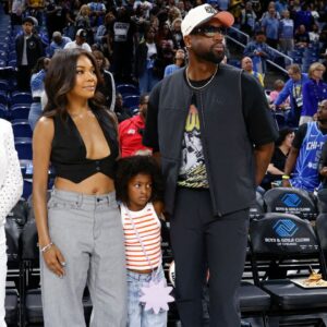 Former basketball player Dwyane Wade attends with his wife Gabrielle Union a WNBA game between the Chicago Sky and Connecticut Sun at Wintrust Arena.