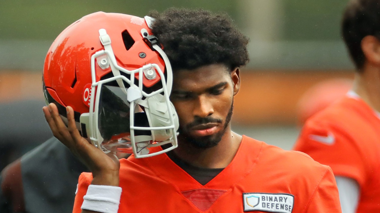 Cleveland Browns quarterback Shedeur Sanders (12) listens to the play calling on the sideline during an NFL practice at the Cleveland Browns training facility on Wednesday, May 28, 2025, in Berea, Ohio.