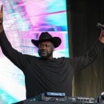 Shaquille O'Neal holds up the sign of the horns during a DJ performance ahead of the College Football Playoff semifinal game between the Texas Longhorns and Ohio State in the Cotton Bowl at AT&T Stadium on Friday, Jan. 10, 2024 in Arlington, Texas.