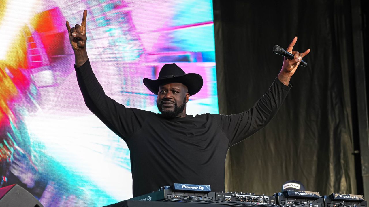 Shaquille O'Neal holds up the sign of the horns during a DJ performance ahead of the College Football Playoff semifinal game between the Texas Longhorns and Ohio State in the Cotton Bowl at AT&T Stadium on Friday, Jan. 10, 2024 in Arlington, Texas.