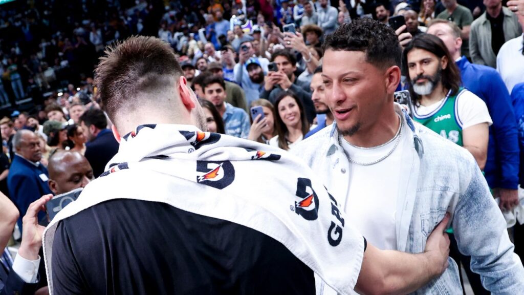 Los Angeles Lakers guard Luka Doncic (77) hugs Kansas City Chiefs quarterback Patrick Mahomes after the game against the Dallas Mavericks at American Airlines Center.