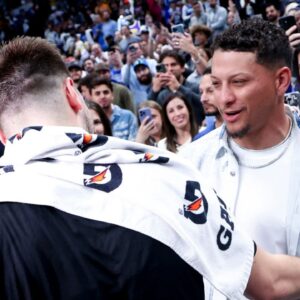 Los Angeles Lakers guard Luka Doncic (77) hugs Kansas City Chiefs quarterback Patrick Mahomes after the game against the Dallas Mavericks at American Airlines Center.