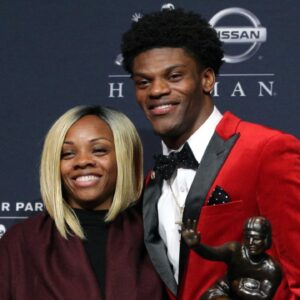 Louisville quarterback Lamar Jackson and his mother Felicia Jones pose with the trophy during a press conference at the New York Marriott Marquis after winning the 2016 Heisman Trophy award during a presentation at the Playstation Theater.
