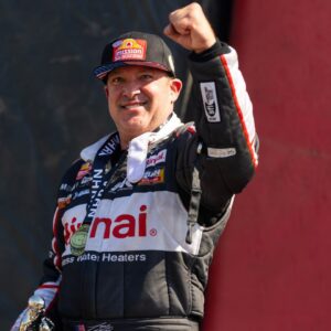 NHRA top fuel driver Tony Stewart celebrates after winning the Route 66 Nationals at Route 66 Raceway.