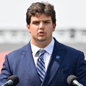New England Patriots first round draft pick Will Campbell addresses media during a press conference on the game field at Gillette Stadium.