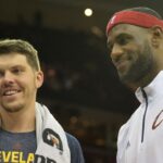 Oct 14, 2014; Cleveland, OH, USA; Cleveland Cavaliers forward LeBron James (right) reacts with forward Mike Miller (18) during a timeout against the Milwaukee Bucks at Quicken Loans Arena. Cleveland won 106-100. Mandatory Credit: David Richard-Imagn Images