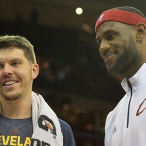 Oct 14, 2014; Cleveland, OH, USA; Cleveland Cavaliers forward LeBron James (right) reacts with forward Mike Miller (18) during a timeout against the Milwaukee Bucks at Quicken Loans Arena. Cleveland won 106-100. Mandatory Credit: David Richard-Imagn Images
