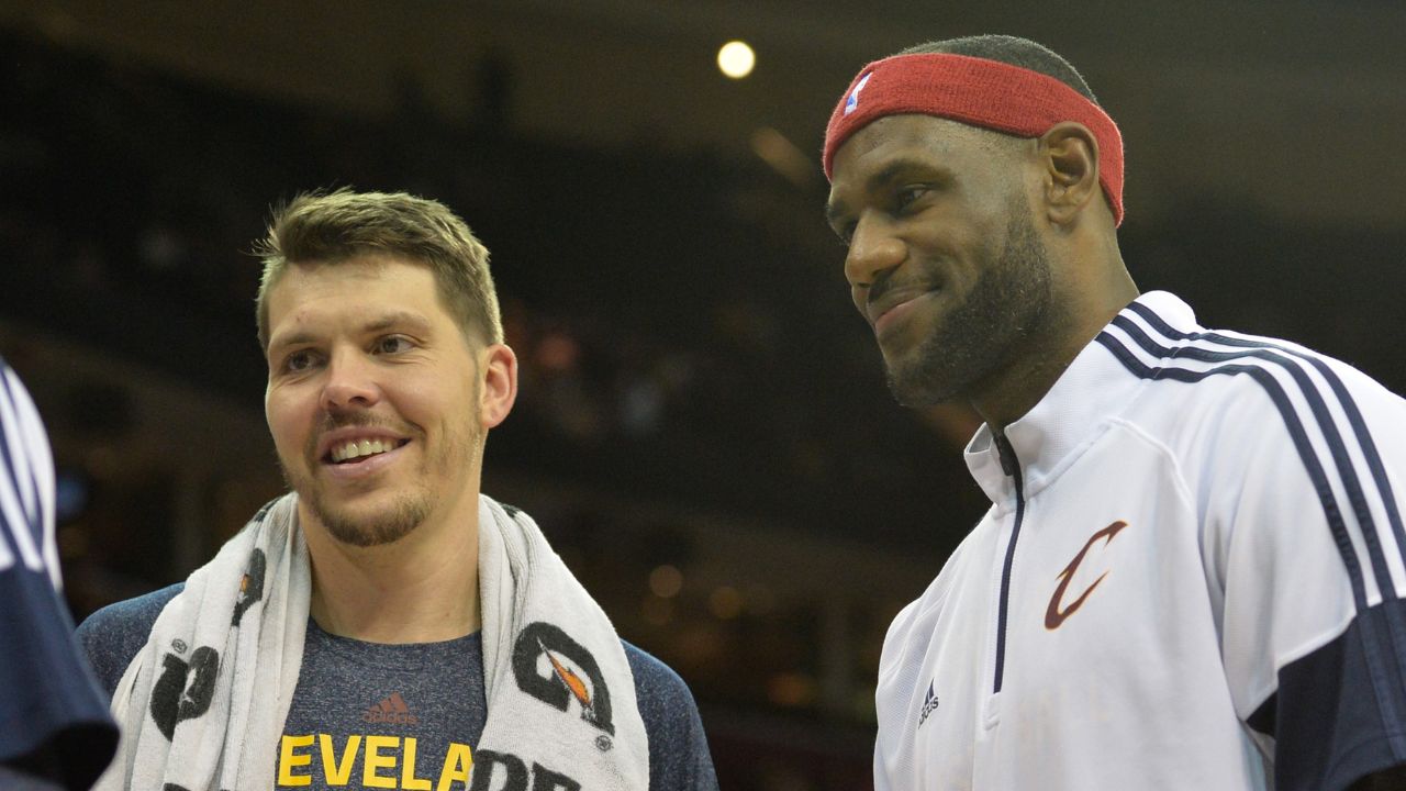 Oct 14, 2014; Cleveland, OH, USA; Cleveland Cavaliers forward LeBron James (right) reacts with forward Mike Miller (18) during a timeout against the Milwaukee Bucks at Quicken Loans Arena. Cleveland won 106-100. Mandatory Credit: David Richard-Imagn Images