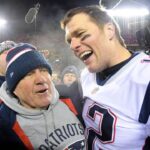 New England Patriots head coach Bill Belichick and quarterback Tom Brady (12) celebrate the win over the Kansas City Chiefs during overtime in the AFC Championship game at Arrowhead Stadium.