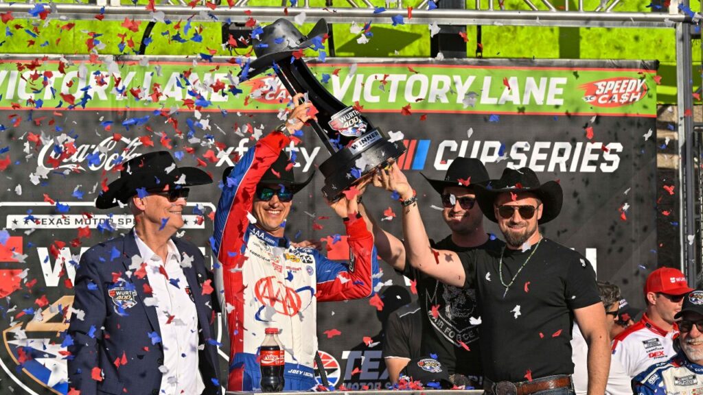 NASCAR Cup Series driver Joey Logano (22) celebrates in victory lane with the winner’s trophy after he wins the Wurth 400 race at Texas Motor Speedway.