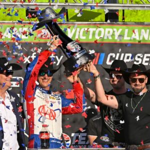 NASCAR Cup Series driver Joey Logano (22) celebrates in victory lane with the winner’s trophy after he wins the Wurth 400 race at Texas Motor Speedway.
