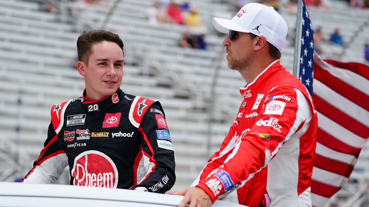 NASCAR Cup Series driver Christopher Bell (20) and NASCAR Cup Series driver Denny Hamlin (11) ride to pit road before the start of the Quaker State 400 at Atlanta Motor Speedway.