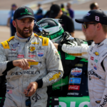 Nov 4, 2022; Avondale, Arizona, USA; NASCAR Cup Series driver Austin Dillon (left) talks with teammate Tyler Reddick during qualifying for the NASCAR championship race at Phoenix Raceway. Mandatory Credit: Mark J. Rebilas-Imagn Images