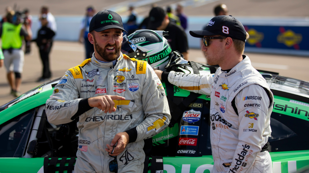 Nov 4, 2022; Avondale, Arizona, USA; NASCAR Cup Series driver Austin Dillon (left) talks with teammate Tyler Reddick during qualifying for the NASCAR championship race at Phoenix Raceway. Mandatory Credit: Mark J. Rebilas-Imagn Images