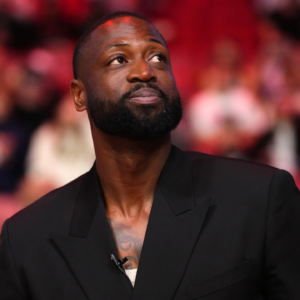 Former Miami Heat player Dwyane Wade reacts after learning a statue will be erected outside of Kaseya Center in 2025