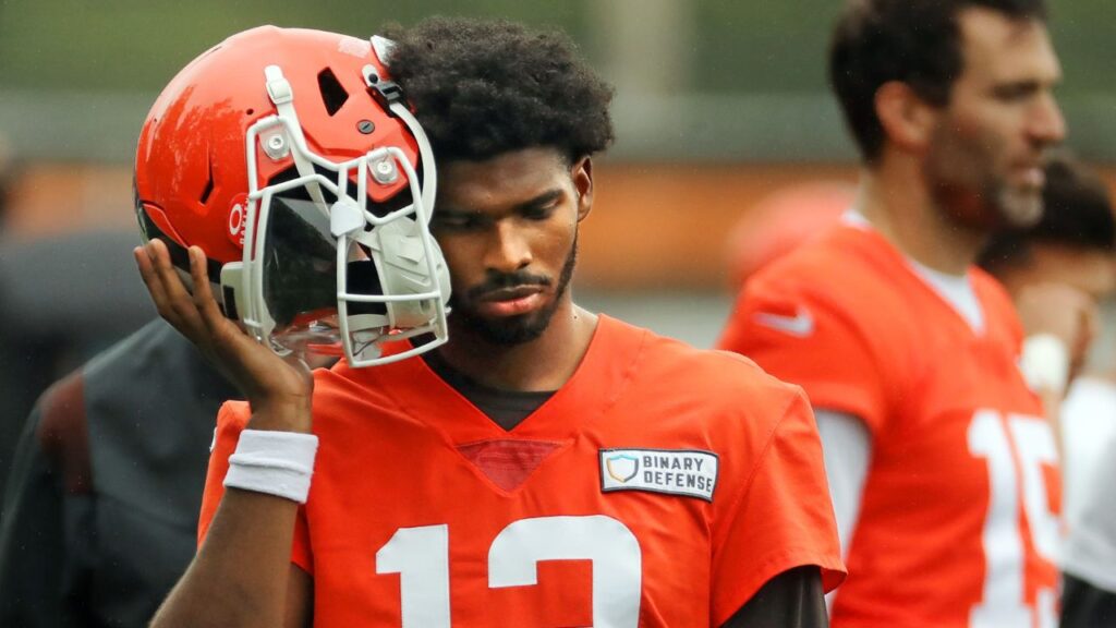 Cleveland Browns quarterback Shedeur Sanders (12) listens to the play calling on the sideline during an NFL practice at the Cleveland Browns training facility on Wednesday, May 28, 2025, in Berea, Ohio.