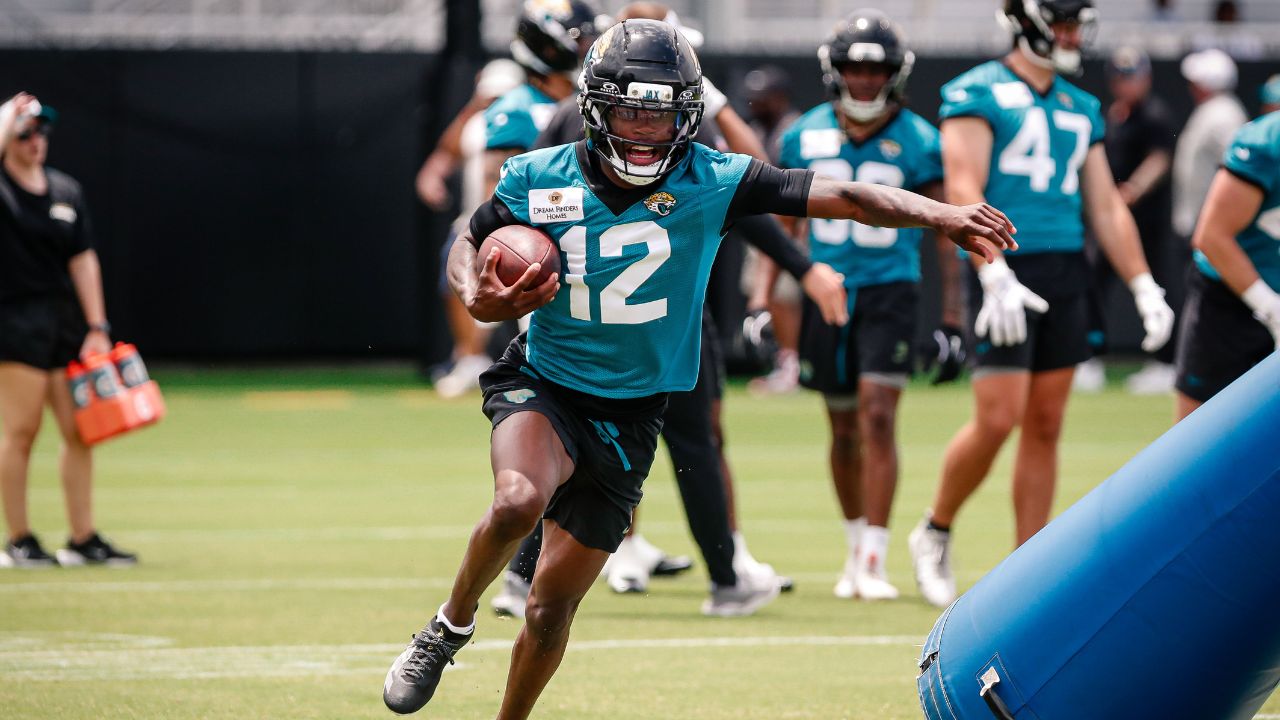 Jacksonville Jaguars wide receiver Travis Hunter (12) participates in a drill during rookie minicamp at Miller Electric Center.