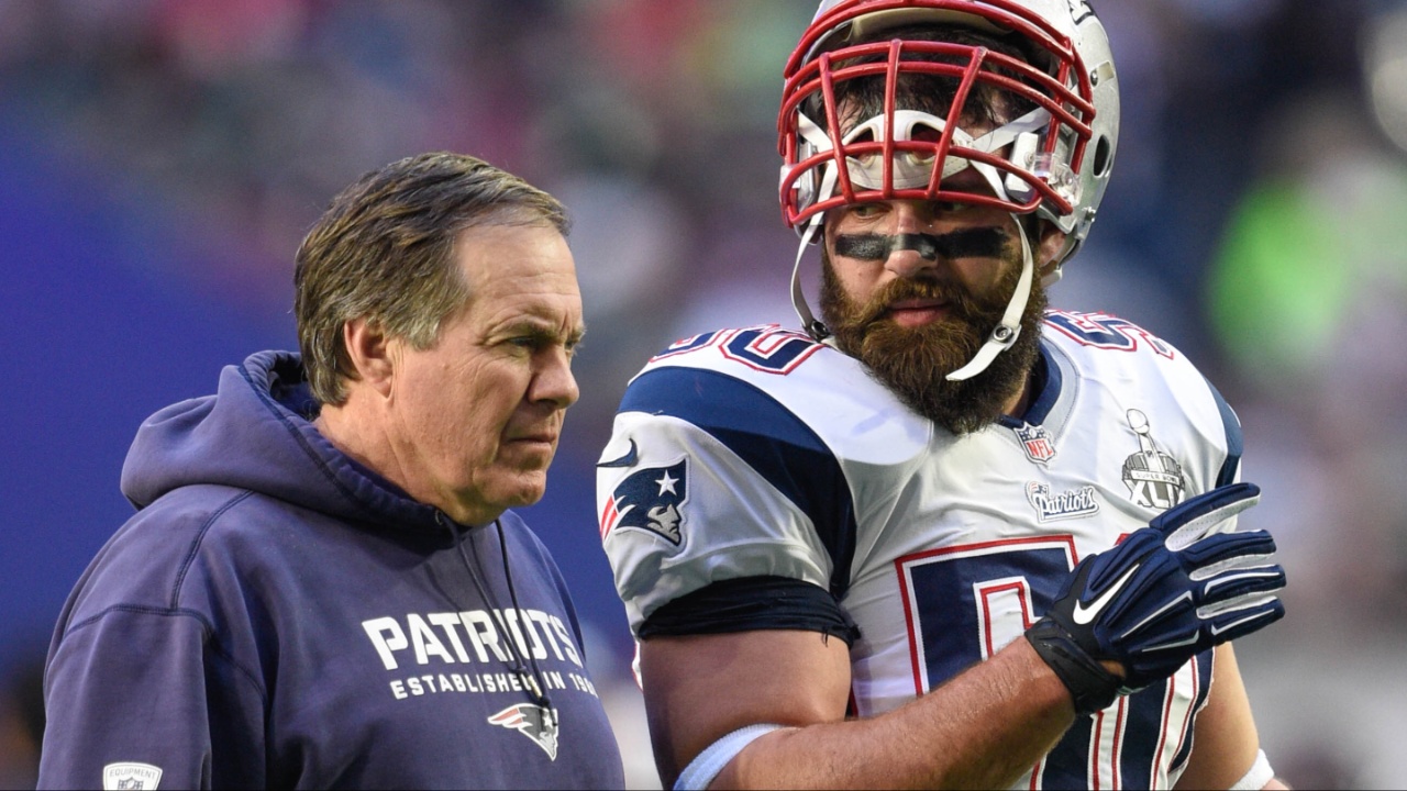 New England Patriots head coach Bill Belichick (left) and defensive end Rob Ninkovich (50) talk before Super Bowl XLIX against the Seattle Seahawks at University of Phoenix Stadium. The Patriots defeated the Seahawks 28-24.