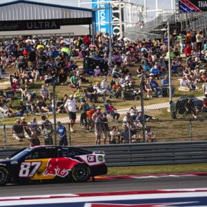 Fans watch Red Bull Chevrolet driver Connor Zilisch (87) round turn 18 during the NASCAR Cup Series EchoPark Automotive Grand Prix at Circuit of the Americas on Sunday, March 2, 2025 in Austin.