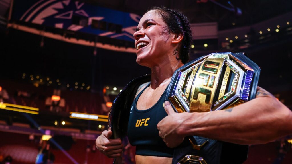 Amanda Nunes celebrates her victory by decision against Irene Aldana following UFC 289 at Rogers Arena.