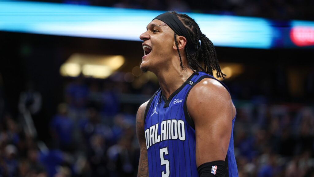 Apr 15, 2025; Orlando, Florida, USA; Orlando Magic forward Paolo Banchero (5) reacts after a play against the Atlanta Hawks in the fourth quarter at Kia Center