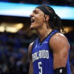 Apr 15, 2025; Orlando, Florida, USA; Orlando Magic forward Paolo Banchero (5) reacts after a play against the Atlanta Hawks in the fourth quarter at Kia Center