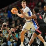 Duke Blue Devils forward Cooper Flagg (2) controls the ball against Houston Cougars guard L.J. Cryer (4) during the first half in the semifinals of the men's Final Four of the 2025 NCAA Tournament at the Alamodome.