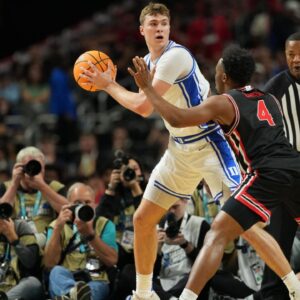 Duke Blue Devils forward Cooper Flagg (2) controls the ball against Houston Cougars guard L.J. Cryer (4) during the first half in the semifinals of the men's Final Four of the 2025 NCAA Tournament at the Alamodome.