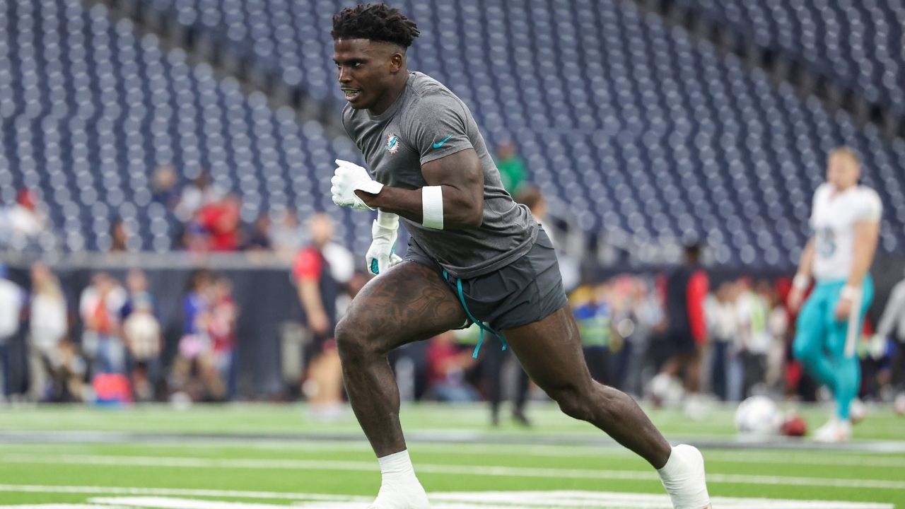 Miami Dolphins wide receiver Tyreek Hill (10) warms up before the game against the Houston Texans at NRG Stadium.