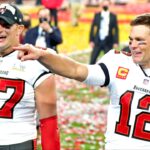 Tampa Bay Buccaneers quarterback Tom Brady (12) and tight end Rob Gronkowski (87) celebrate after beating the Kansas City Chiefs in Super Bowl LV at Raymond James Stadium.