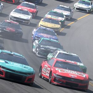 The field accelerates through turn one on a restart in stage two of NASCAR's FireKeepers Casino 400 at Michigan International Speedway.