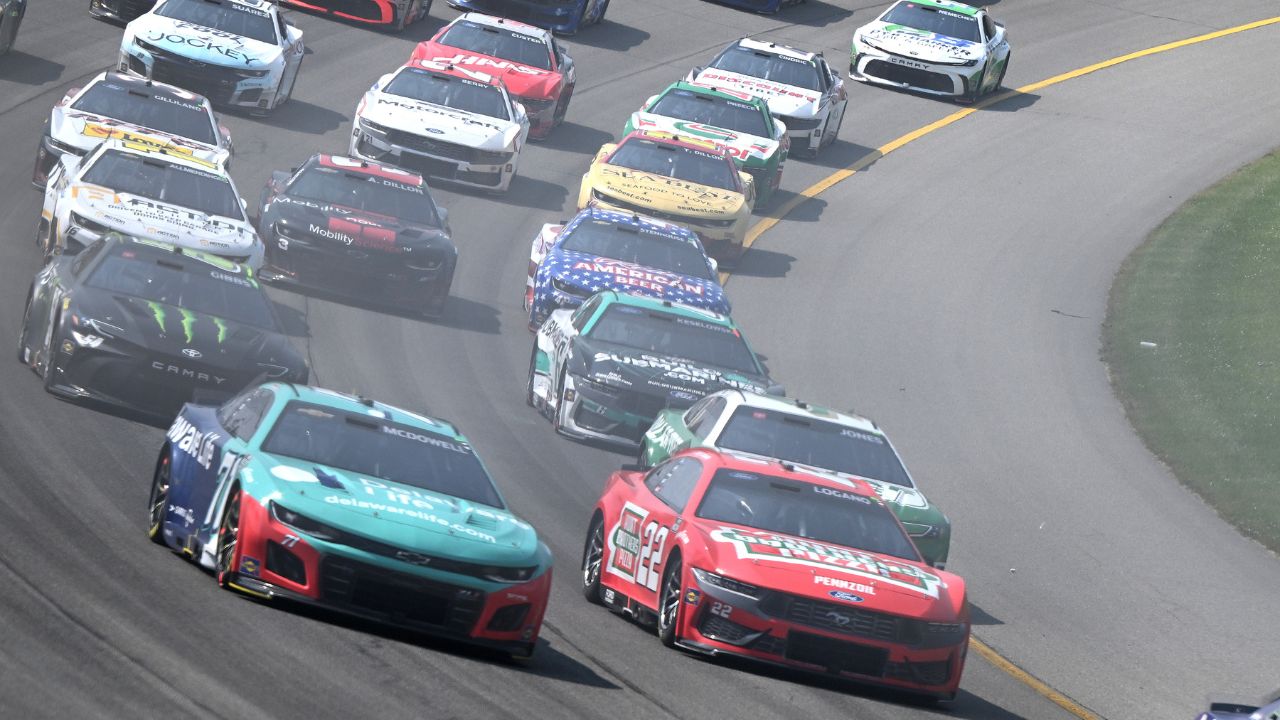 The field accelerates through turn one on a restart in stage two of NASCAR's FireKeepers Casino 400 at Michigan International Speedway.
