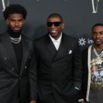 Deion Sanders with his sons Shedeur Sanders (left) and Deion Sanders Jr. (right) on the red carpet before Super Bowl LIX NFL Honors at Saenger Theatre.
