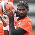 Cleveland Browns quarterback Shedeur Sanders (12) listens to a play call during mini camp at CrossCountry Mortgage Campus.