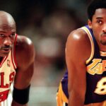 Michael Jordan has a chat with the Lakers Kobe Bryant during free throws in 1997