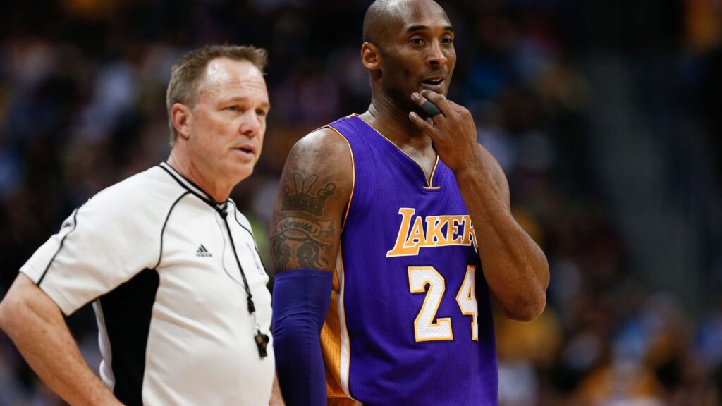 Mar 2, 2016; Denver, CO, USA; Los Angeles Lakers forward Kobe Bryant (24) talks with referee Bill Spooner (22) in the first quarter of the game against the Denver Nuggets at the Pepsi Center. | Credits- Isaiah J. Downing-Imagn Images