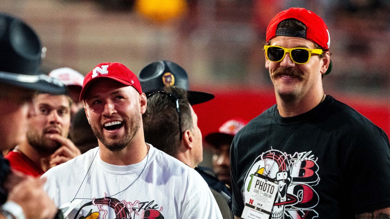 Bussin’ With The Boys’ Will Compton and Taylor Lewan stand on the sideline during the third quarter between the Nebraska Cornhuskers and the Colorado Buffaloes at Memorial Stadium.