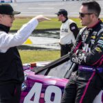 Former NASCAR driver Jeff Gordon visits pit row to talk with NASCAR Cup Series driver Alex Bowman (48) before the 2023 YellaWood 500 at Talladega Superspeedway.