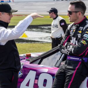 Former NASCAR driver Jeff Gordon visits pit row to talk with NASCAR Cup Series driver Alex Bowman (48) before the 2023 YellaWood 500 at Talladega Superspeedway.
